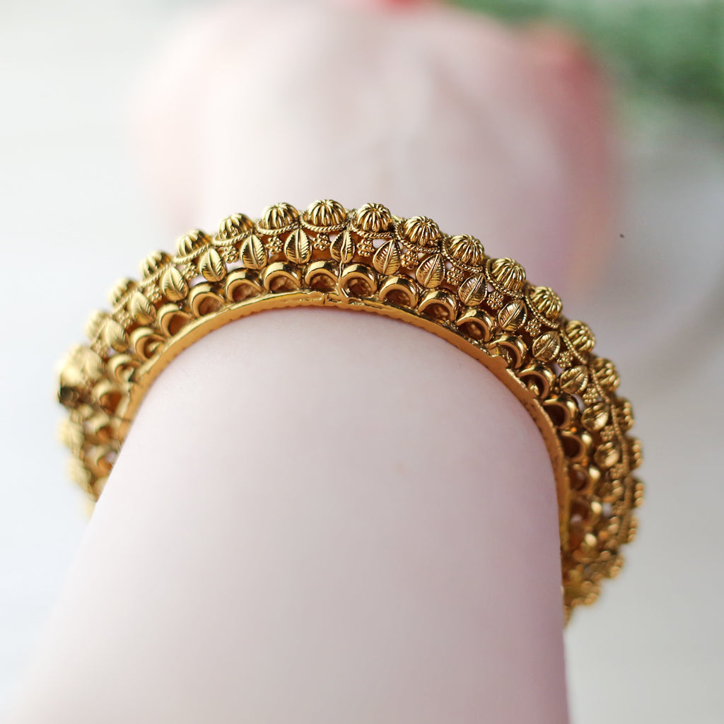 Gold lock bangles on sale designs